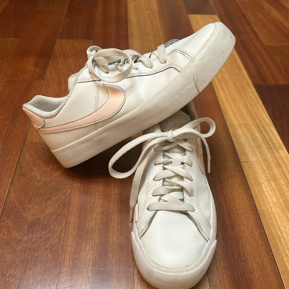 Nike white leather sneakers with light pink swoosh. Size 7. Great used condition